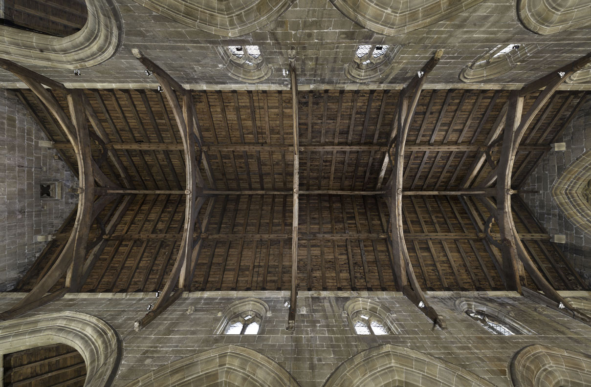 Historic oak roof timbers and Gothic arches inside the church