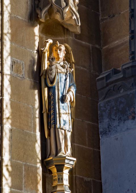 Carved stone statue and architectural detail at St John the Baptist